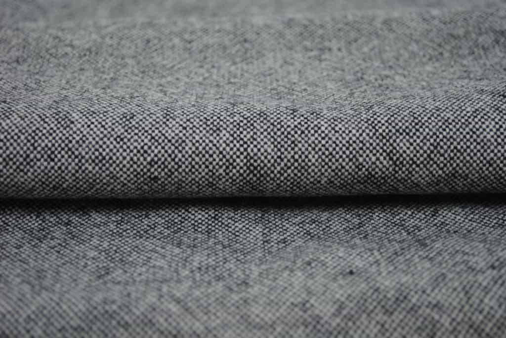 details of white gang woolen jacket fabric