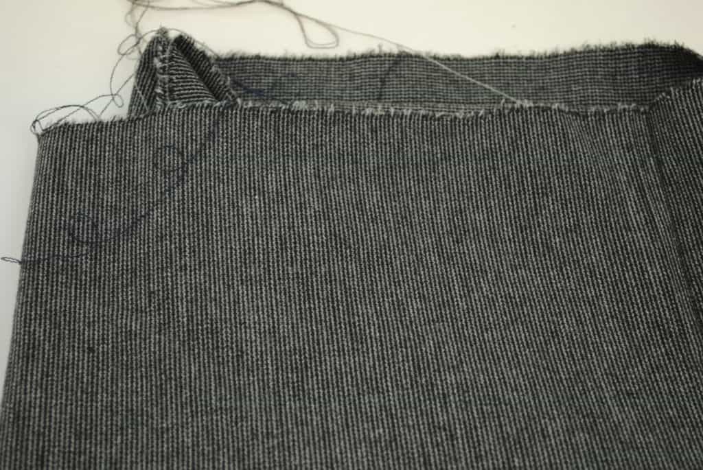 details of woolen jacket fabric white stripe