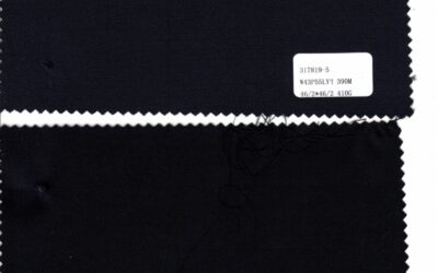 Close up of black 50 wool suiting stock fabric showing smooth twill weave